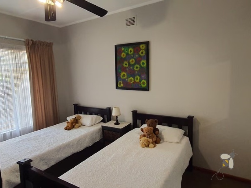 Standerton Central, luxurious home for sale, 4 bedroom house, Jacuzzi bath, open-plan living, built-in braai, 3 garages, 3 carports, income potential, water tank, well-maintained.