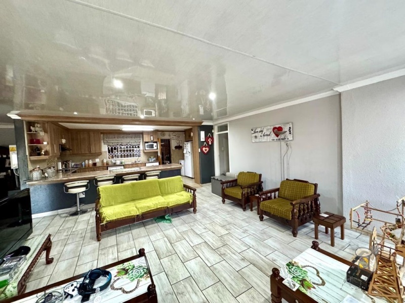 Secunda, modern family home, 4 bedroom house for sale, solar power, inverter system, JoJo tank, built-in braai, entertainer\'s carport, PVC ceilings, touch-screen stove, double garage.