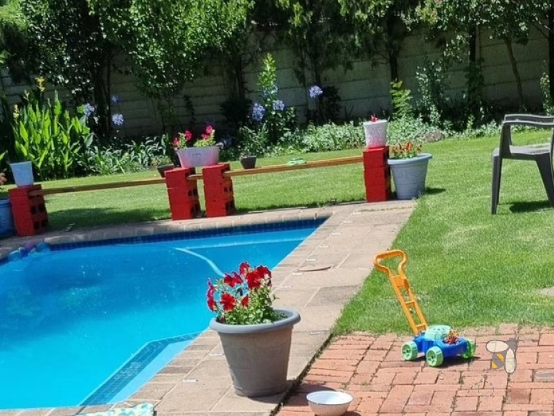 Standerton Central, 3 bedroom home for sale, braai room, indoor entertainment, dual braai areas, open-plan living, dream retreat, spacious lounge, modern living.