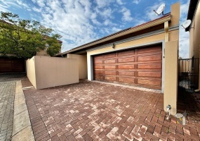 Secunda, Tuscan style, 2 bedroom house for sale, two en-suite bedrooms, open-plan living, outdoor braai area, charming residence, double garage, modern amenities.