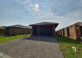 Secunda, 3 bedroom freehold for sale, modern home, open-plan living, double automated garage, stylish bathrooms, tiled flooring, prestigious neighborhood, luxurious finishes.