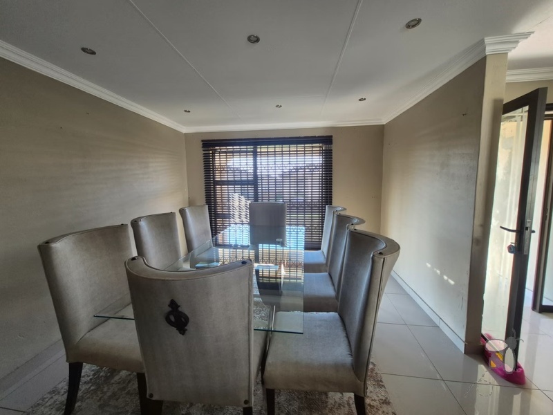 Secunda, 3 bedroom townhouse for sale, modern townhouse, open-plan living, separate scullery, JoJo tank, single automated garage, carport for two, secure complex, low maintenance.