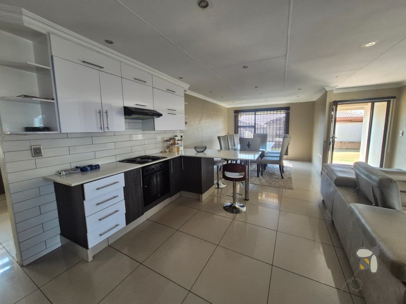 Secunda, 3 bedroom townhouse for sale, modern townhouse, open-plan living, separate scullery, JoJo tank, single automated garage, carport for two, secure complex, low maintenance.