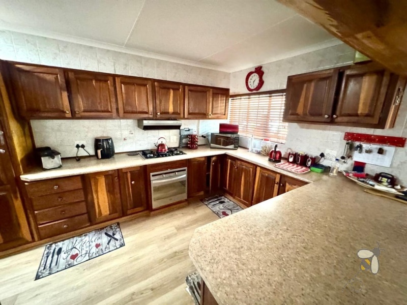 Secunda Central, 2 bedroom house for sale, 3rd bedroom potential, gated community, secure complex, gas hob, built-in braai, enclosed patio, double basins, double carport, solid wood kitchen.