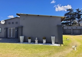Meyerville, 4 bedroom house for sale, first time family home, two lounges, 2500L water tank, generator switch-over, double garage, 5 carports, practical laundry.
