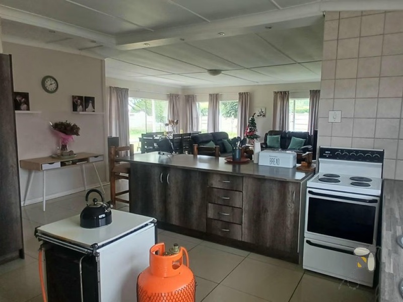 Meyerville, 4 bedroom house for sale, renovated home, laminated floors, open-plan living, inverter system, 7kW battery, eco-friendly, two garages, Laer Skool Kalie de Haas.