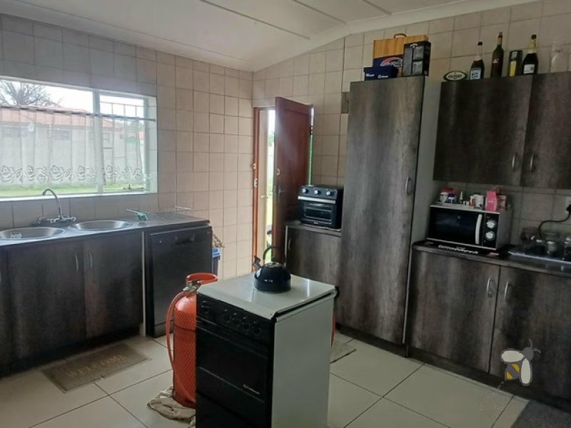 Meyerville, 4 bedroom house for sale, renovated home, laminated floors, open-plan living, inverter system, 7kW battery, eco-friendly, two garages, Laer Skool Kalie de Haas.