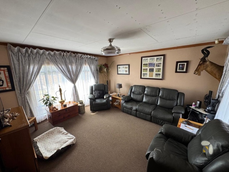 Secunda, 4 bedroom house for sale, brickface home, corner stand, gas hob, built-in braai, Jojo tank, double carports, two living areas, solid construction, scullery.