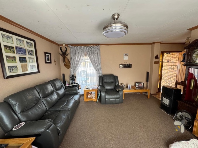 Secunda, 4 bedroom house for sale, brickface home, corner stand, gas hob, built-in braai, Jojo tank, double carports, two living areas, solid construction, scullery.