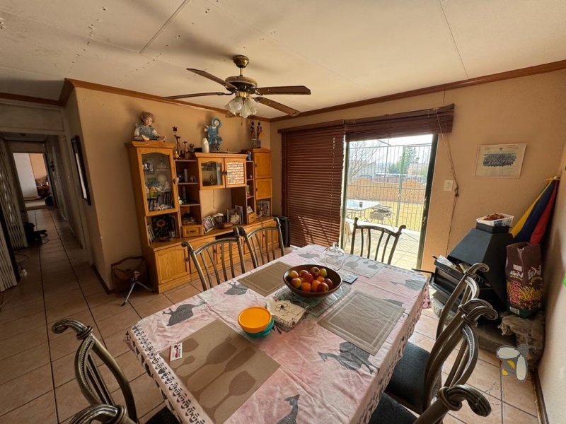 Secunda, 4 bedroom house for sale, brickface home, corner stand, gas hob, built-in braai, Jojo tank, double carports, two living areas, solid construction, scullery.