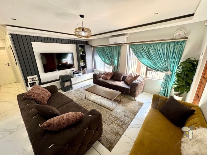 Secunda, 3 bedroom house for sale, modernised home, built-in braai, JoJo tank with pump, Caesarstone kitchen, open-plan living, double automated garage, low maintenance, secure setting.