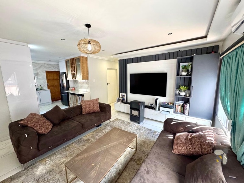 Secunda, 3 bedroom house for sale, modernised home, built-in braai, JoJo tank with pump, Caesarstone kitchen, open-plan living, double automated garage, low maintenance, secure setting.