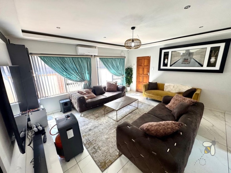 Secunda, 3 bedroom house for sale, modernised home, built-in braai, JoJo tank with pump, Caesarstone kitchen, open-plan living, double automated garage, low maintenance, secure setting.