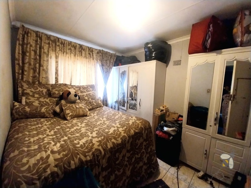 Embalenhle, 2 bedroom house for sale, investment property, rental income, bachelor rooms, R10000 monthly income, first-time buyer, additional income, lucrative opportunity.