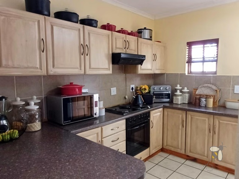 Standerton Central, 3 bedroom townhouse for sale, modern living, inverter system, 2400L water tank, double garage, private garden, separate dining room, enclosed patio, Wendy house.