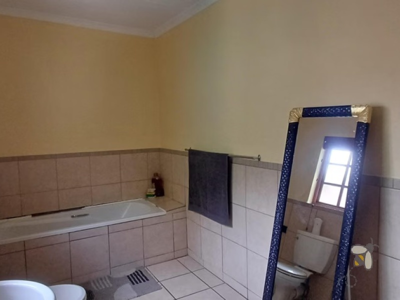 Standerton Central, 3 bedroom townhouse for sale, modern living, inverter system, 2400L water tank, double garage, private garden, separate dining room, enclosed patio, Wendy house.