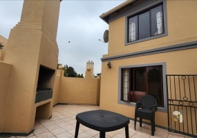 Secunda, 2 bedroom townhouse for sale, double-storey, modern elegance, prestigious estate, open-plan living, built-in bar, built-in braai, motorized double garage, pet-friendly, luxury lifestyle.