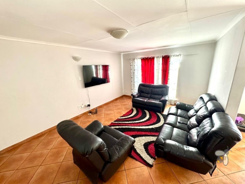 Secunda, 3 bedroom townhouse for sale, great location, granite countertops, full en-suite, double automated garage, private courtyard, two living areas, fully tiled, close to schools.