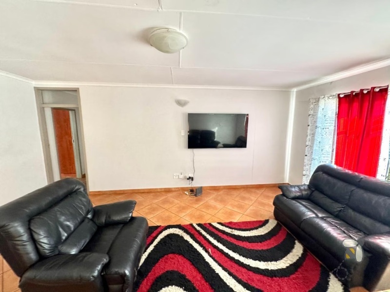 Secunda, 3 bedroom townhouse for sale, great location, granite countertops, full en-suite, double automated garage, private courtyard, two living areas, fully tiled, close to schools.