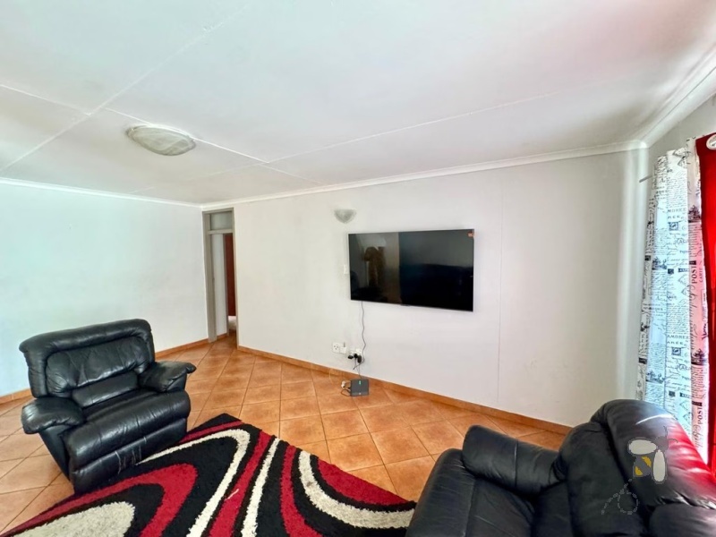 Secunda, 3 bedroom townhouse for sale, great location, granite countertops, full en-suite, double automated garage, private courtyard, two living areas, fully tiled, close to schools.