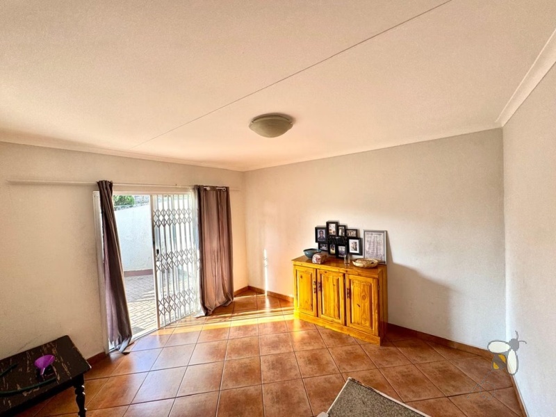 Secunda, 3 bedroom townhouse for sale, great location, granite countertops, full en-suite, double automated garage, private courtyard, two living areas, fully tiled, close to schools.
