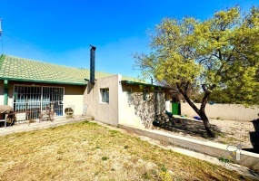 Secunda, 4 bedroom house for sale, indoor braai, multiple living areas, Jetmaster fireplace, bachelor flat, rental income, separate scullery, double carport, two entrances, family home.