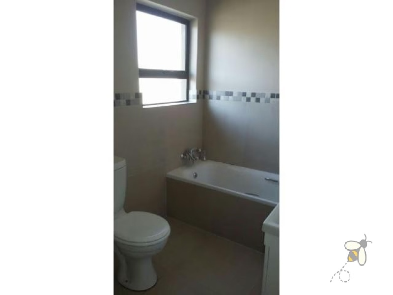 Secunda, 3 bedroom house for sale, secure complex, Extension 23, modern features, wooden flooring, upgraded kitchen, open-plan living, low maintenance garden, under stair storage.