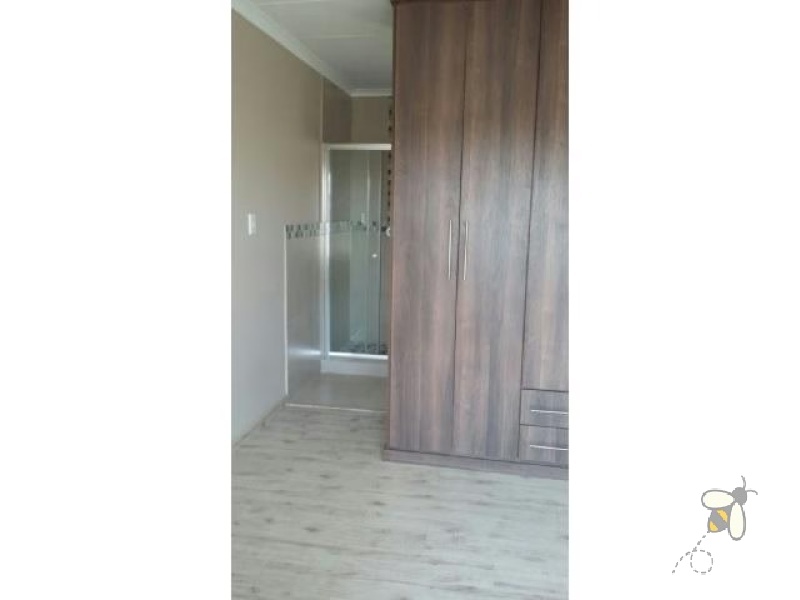 Secunda, 3 bedroom house for sale, secure complex, Extension 23, modern features, wooden flooring, upgraded kitchen, open-plan living, low maintenance garden, under stair storage.