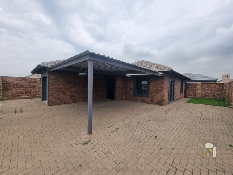 Secunda, modern family home for sale, prime location, gas hob, Trellidor security, double carport, automated gate, spacious yard, close to schools, move-in ready.
