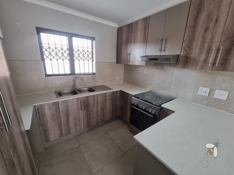Secunda, modern family home for sale, prime location, gas hob, Trellidor security, double carport, automated gate, spacious yard, close to schools, move-in ready.