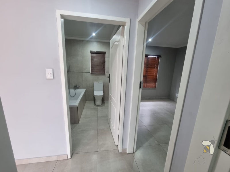 Secunda, modern family home for sale, prime location, gas hob, Trellidor security, double carport, automated gate, spacious yard, close to schools, move-in ready.
