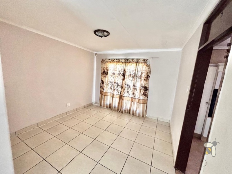 Secunda house for sale, 4 bedroom, spacious home, ample yard space, family living, dedicated dining room, prepaid electricity, garage and carport, practical layout.