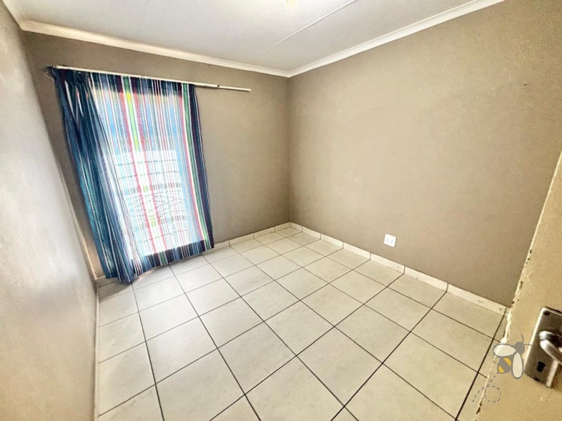 Secunda house for sale, 4 bedroom, spacious home, ample yard space, family living, dedicated dining room, prepaid electricity, garage and carport, practical layout.