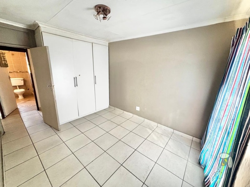 Secunda house for sale, 4 bedroom, spacious home, ample yard space, family living, dedicated dining room, prepaid electricity, garage and carport, practical layout.