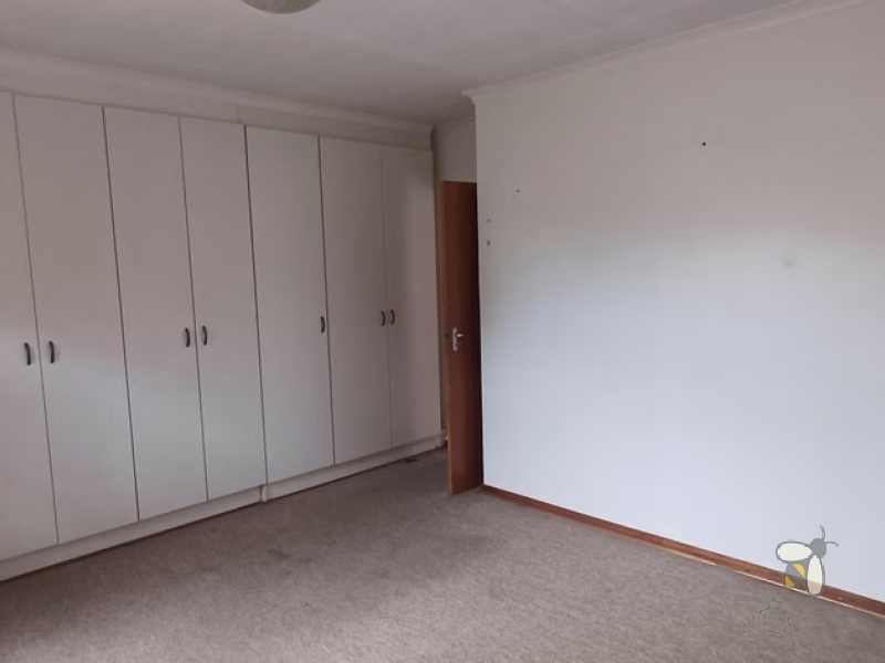 Standerton townhouse for sale, 2 bedroom unit, open plan living, modern kitchen, 2 garages, secure carport, paved courtyard, water tank, low levy