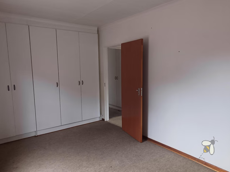 Standerton townhouse for sale, 2 bedroom unit, open plan living, modern kitchen, 2 garages, secure carport, paved courtyard, water tank, low levy