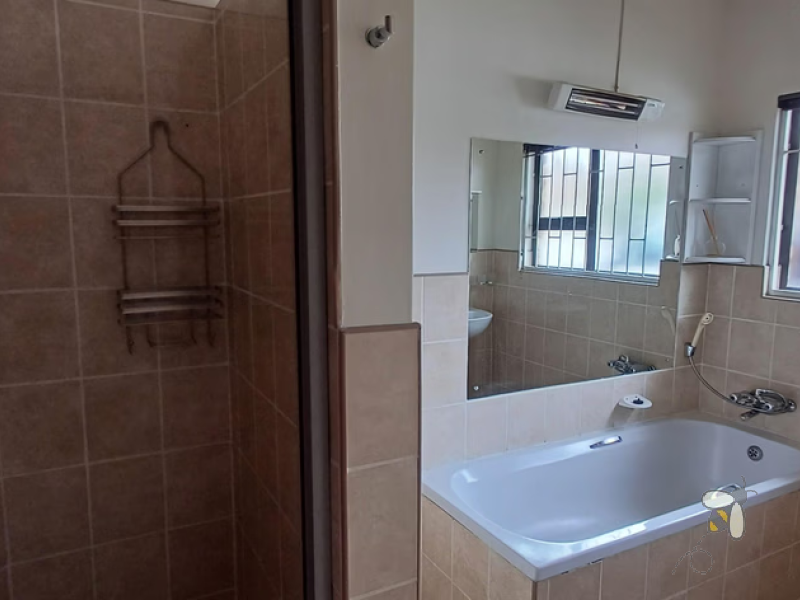 Standerton townhouse for sale, 2 bedroom unit, open plan living, modern kitchen, 2 garages, secure carport, paved courtyard, water tank, low levy