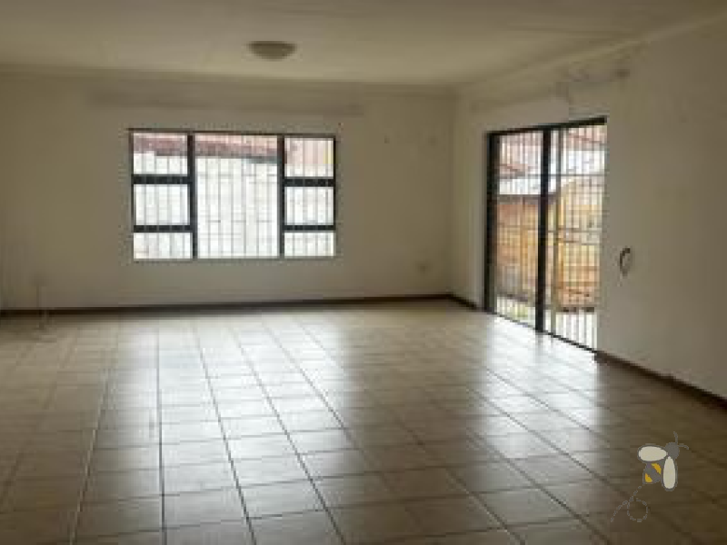 Standerton townhouse for sale, 2 bedroom unit, open plan living, modern kitchen, 2 garages, secure carport, paved courtyard, water tank, low levy