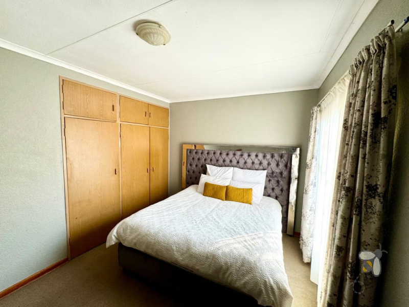 Secunda Central townhouse for sale, 2 bedroom unit, built-in cupboards, open plan kitchen, internal garage access, communal garden, play area