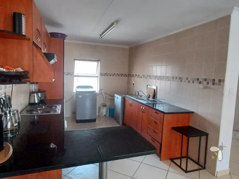 Secunda, flat for sale, spacious apartment, built-in braai, open-plan living, cherry wood kitchen, balcony, professionals, small family