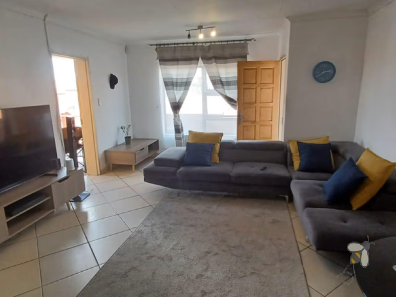 Secunda, flat for sale, spacious apartment, built-in braai, open-plan living, cherry wood kitchen, balcony, professionals, small family