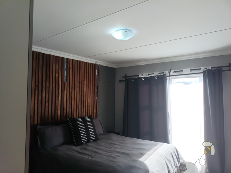 Secunda, apartment for sale, 2 bedroom flat, top floor unit, braai balcony, prepaid electricity, undercover carport, modern kitchen, open plan