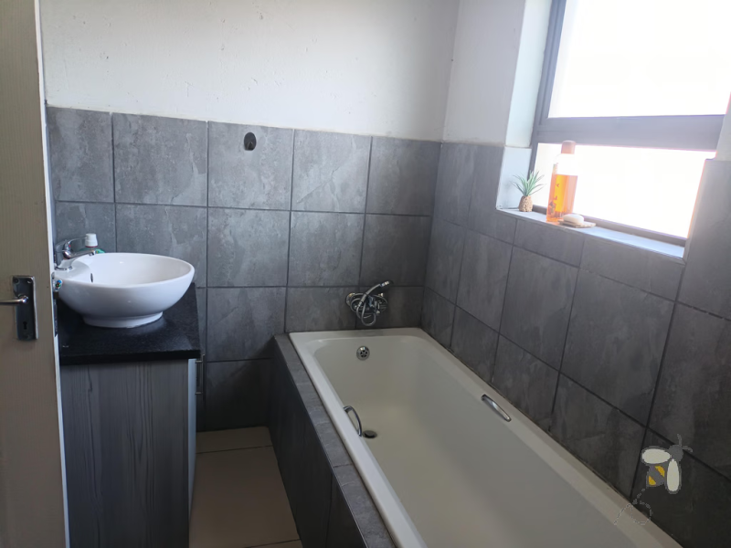 Secunda, apartment for sale, 2 bedroom flat, top floor unit, braai balcony, prepaid electricity, undercover carport, modern kitchen, open plan