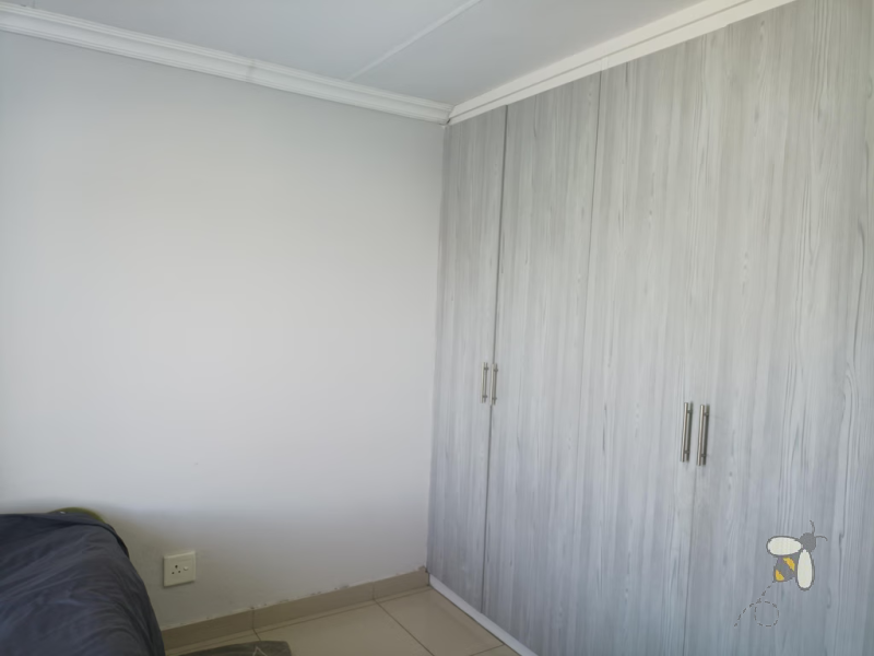 Secunda, apartment for sale, 2 bedroom flat, top floor unit, braai balcony, prepaid electricity, undercover carport, modern kitchen, open plan