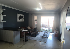 Secunda, apartment for sale, 2 bedroom flat, top floor unit, braai balcony, prepaid electricity, undercover carport, modern kitchen, open plan