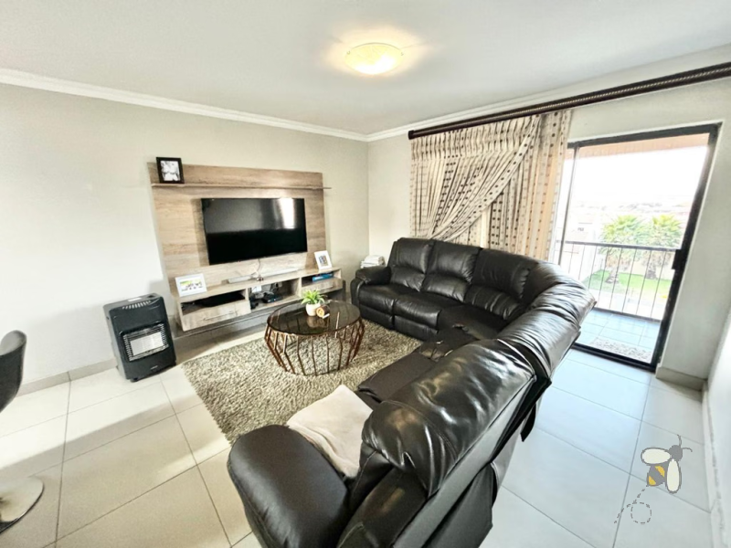 Secunda, apartment for sale, 2 bedroom flat, cozy living, built-in braai, private patio, modern kitchen, shaded parking, well-maintained complex