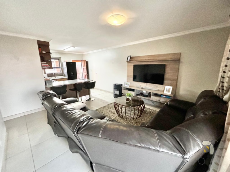 Secunda, apartment for sale, 2 bedroom flat, cozy living, built-in braai, private patio, modern kitchen, shaded parking, well-maintained complex