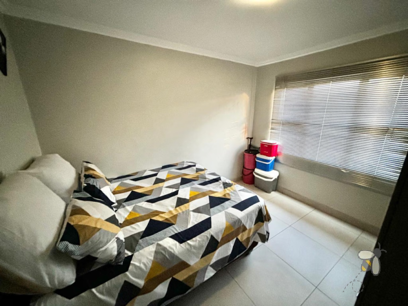 Secunda, apartment for sale, 2 bedroom flat, cozy living, built-in braai, private patio, modern kitchen, shaded parking, well-maintained complex
