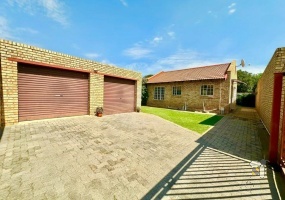 Albemarle Germiston home, 2-bedroom cluster for sale, modern kitchen cluster home, double garage property Germiston, cluster home with garden and braai, Germiston property for sale